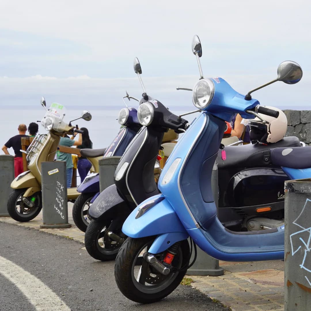 Vespas from the fleet lined up along the seafront promenade