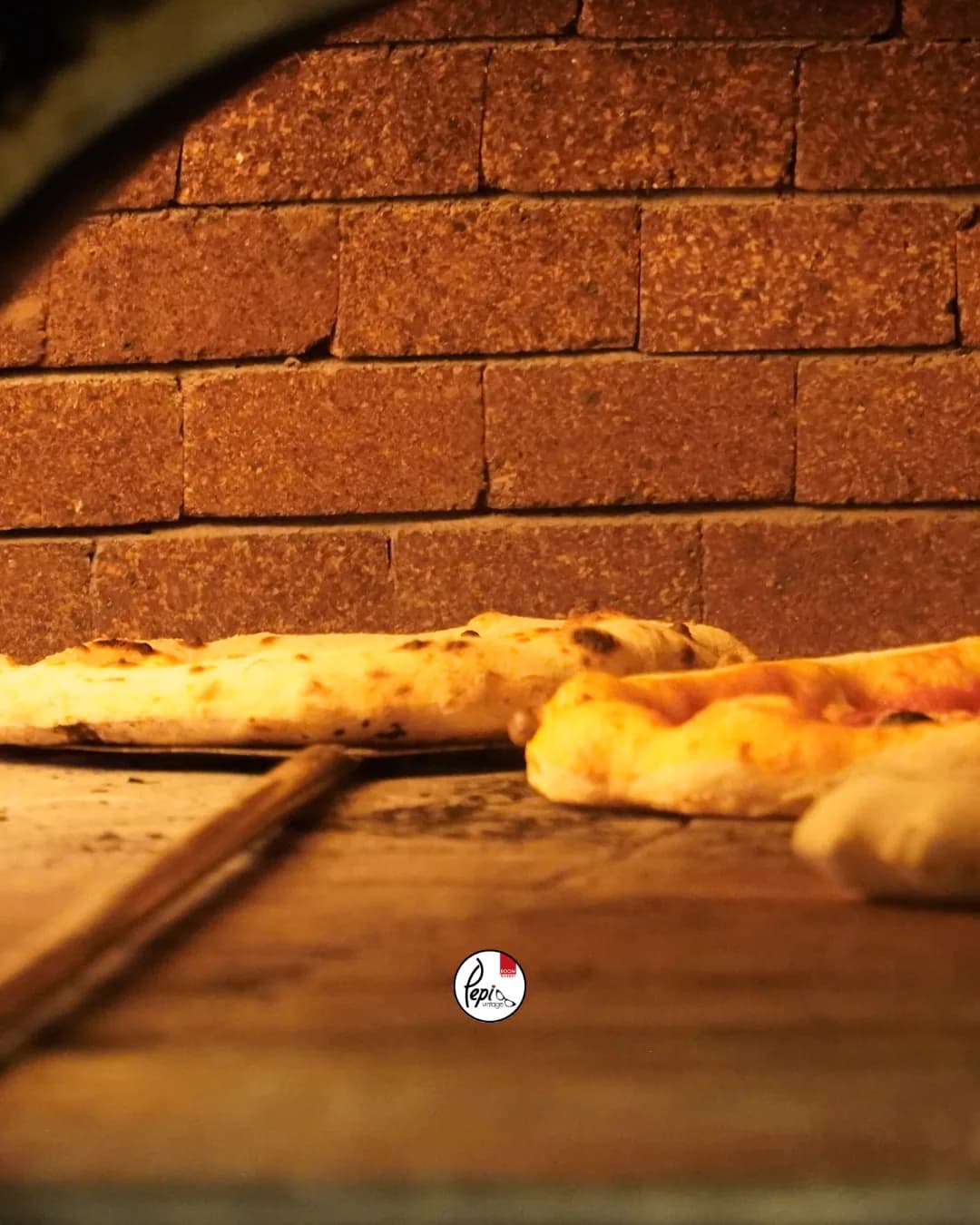 Pizza inside the pizzeria’s wood-fired oven