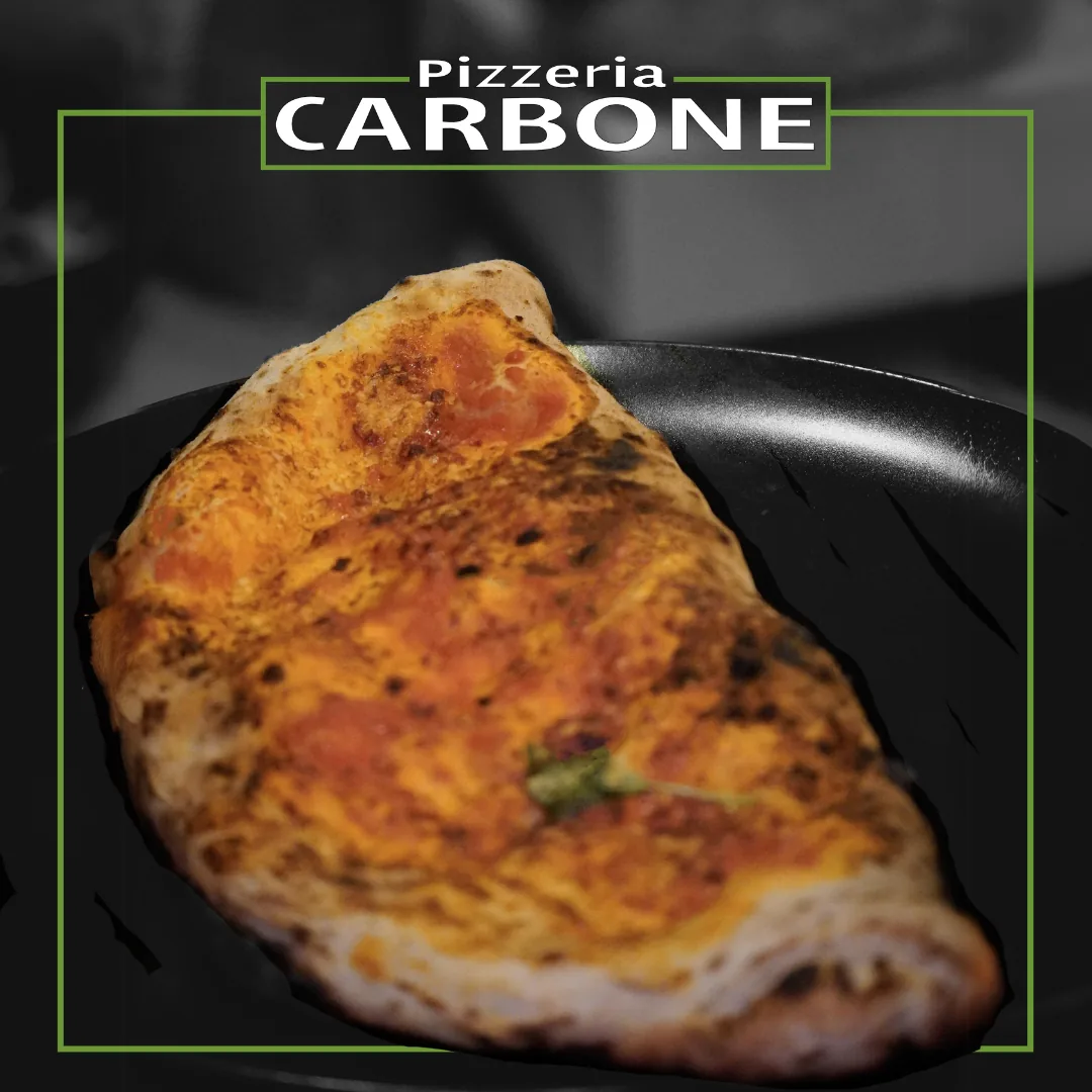 Freshly baked calzone served on a plate