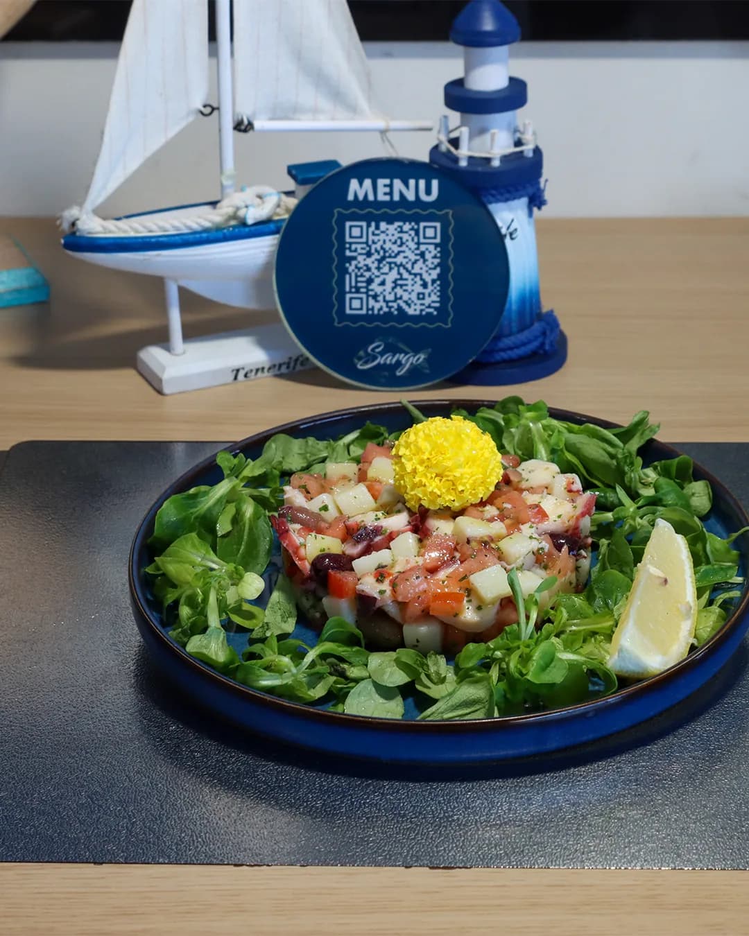 Table set with the restaurant’s QR menu stand